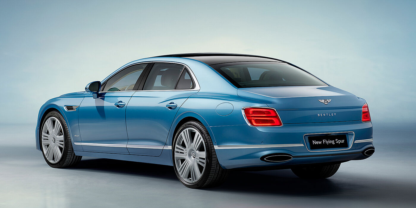 Bentley Kyiv New Bentley Flying Spur Azure sedan rear view in Light windsor blue by Mulliner paint with 22 inch Azure wheels and chrome exterior details