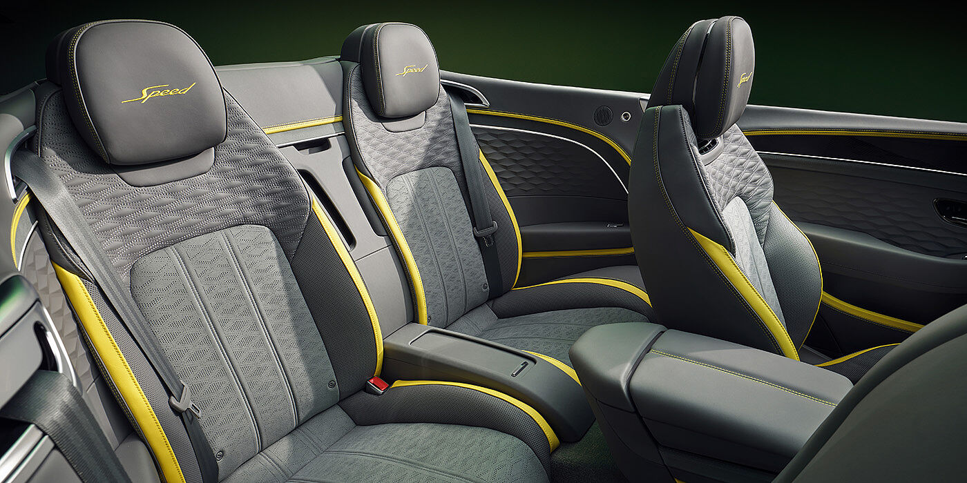 Bentley Kyiv Bentley New Continental GTC Speed convertible rear interior with unique Speed colour split in Gravity Grey and Cyber Yellow hide colours, and contrast stitched headrest emblems 