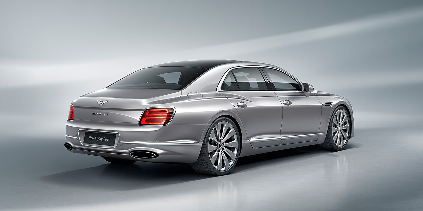 Bentley Kyiv New Bentley Flying Spur sedan rear view in Silverlake paint with ten spoke wheels and chrome matrix grille