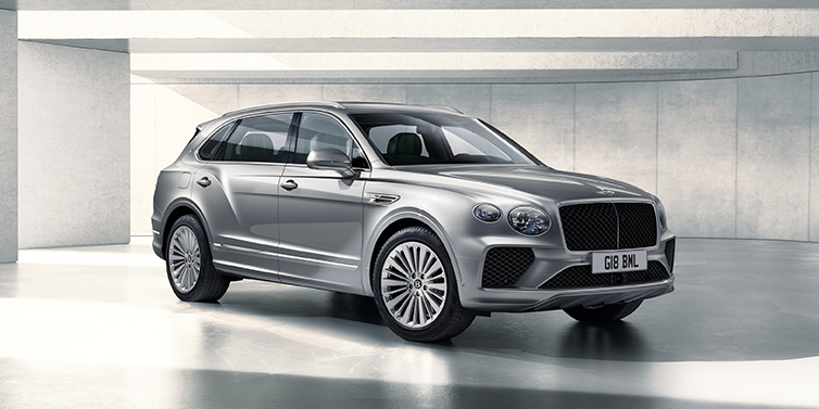 Bentley Kyiv Bentley Bentayga Extended Wheelbase SUV front three quarter in Moonbeam paint with a grey background