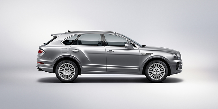 Bentley Kyiv Bentley Bentayga SUV side profile in Moonbeam silver paint against white background featuring 21 inch 5 spoke wheels